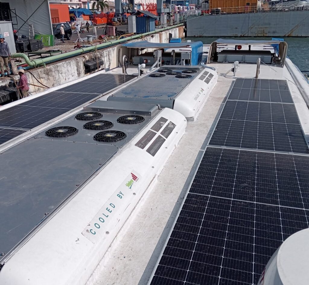 Air conditioning units beside solar panels on the roof of a passenger vessel, Kochi