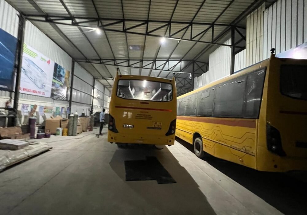 Two buses inside the Hedo Air Conditioning workshop, Edappally, Kochi